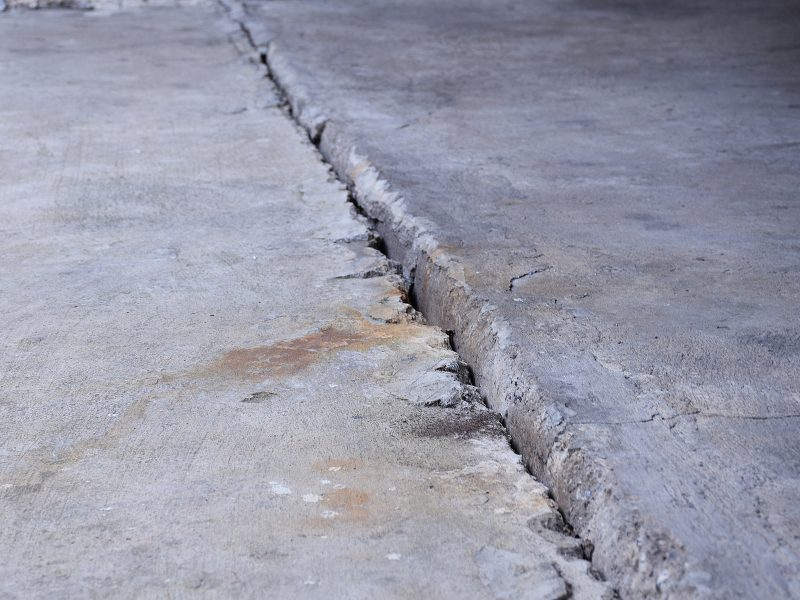 Sunken concrete floor with visible gap showing why fixing sinking concrete is required for stability.